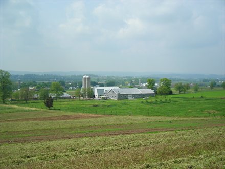 landscape shot of lancaster, PA with rolling hills and amish farms