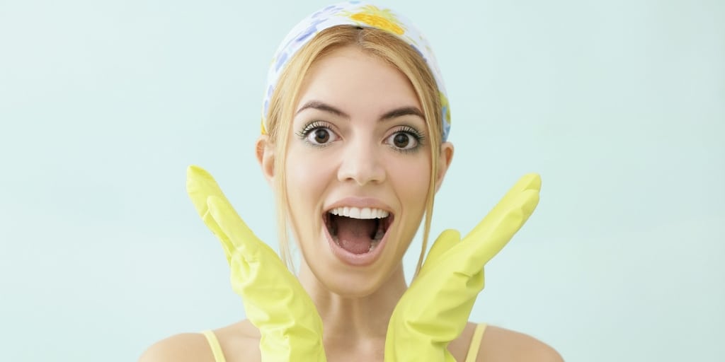 woman with handkerchief on, and yellow gloves, exclaiming