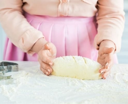 image of woman baking bread from scratch, like in the Great Depression