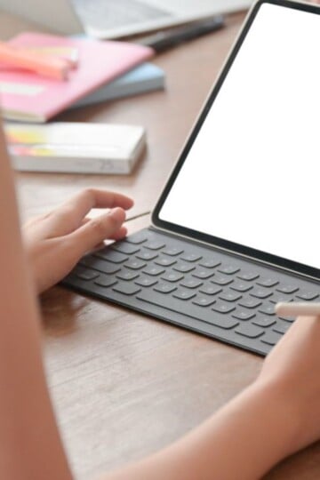 iPad screen with woman looking at it
