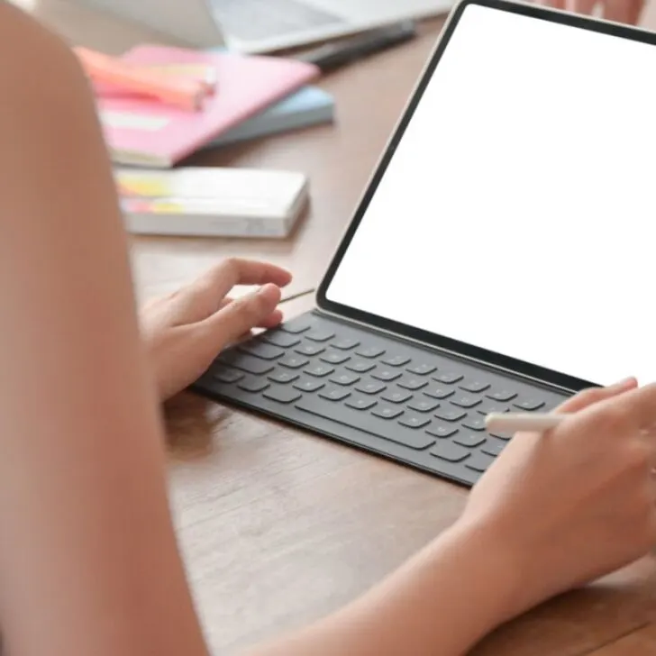 iPad screen with woman looking at it