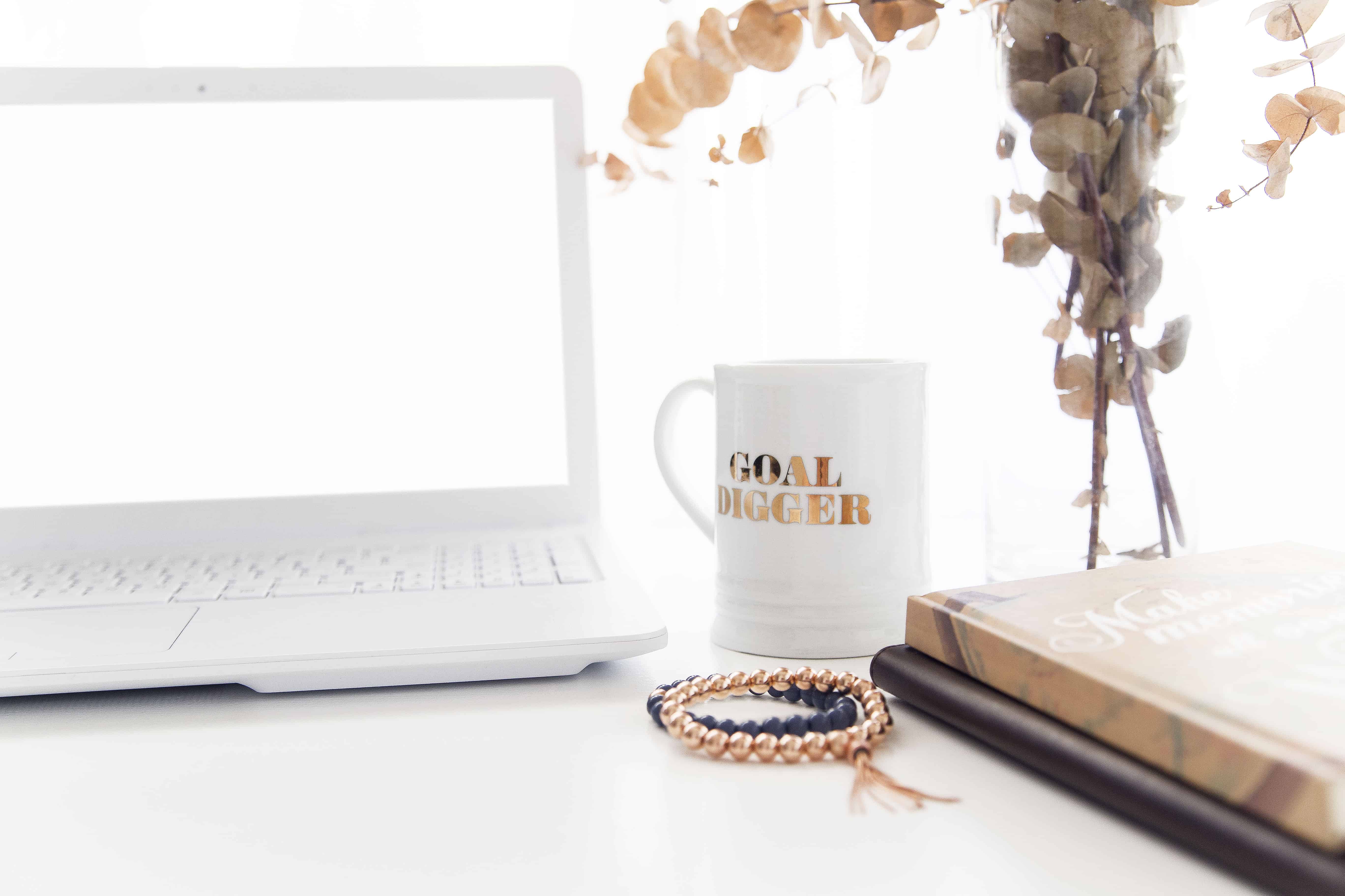 white desktop with goal-digger, coffee mug for weight loss competition inspiration