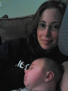 Mommy and Conner, while Conner is sleeping, sitting on couch