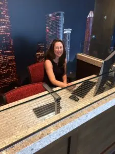 author behind desk using computer at PurePoint bank