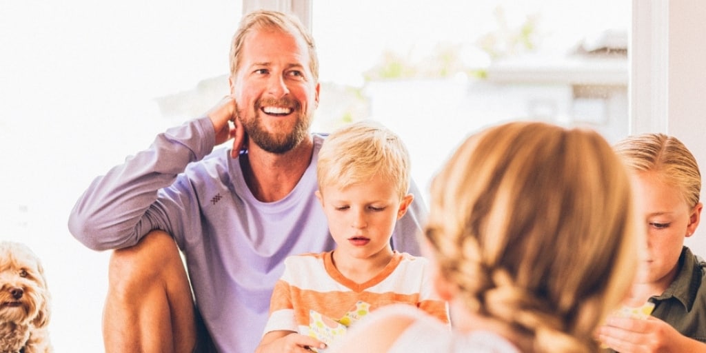 family sitting around, laughing