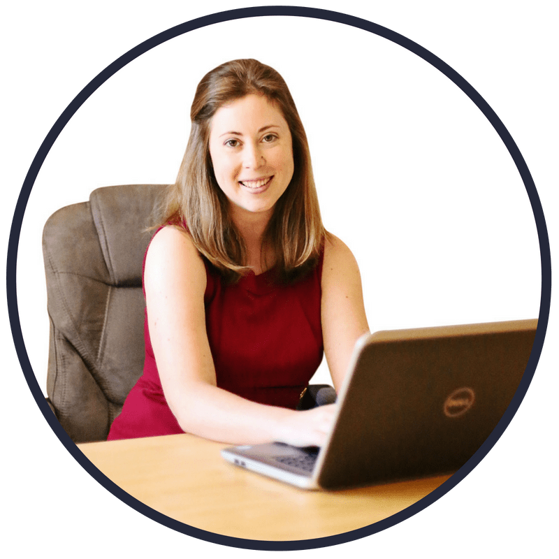 young woman behind computer, at desk, a frugal living personal finance writer