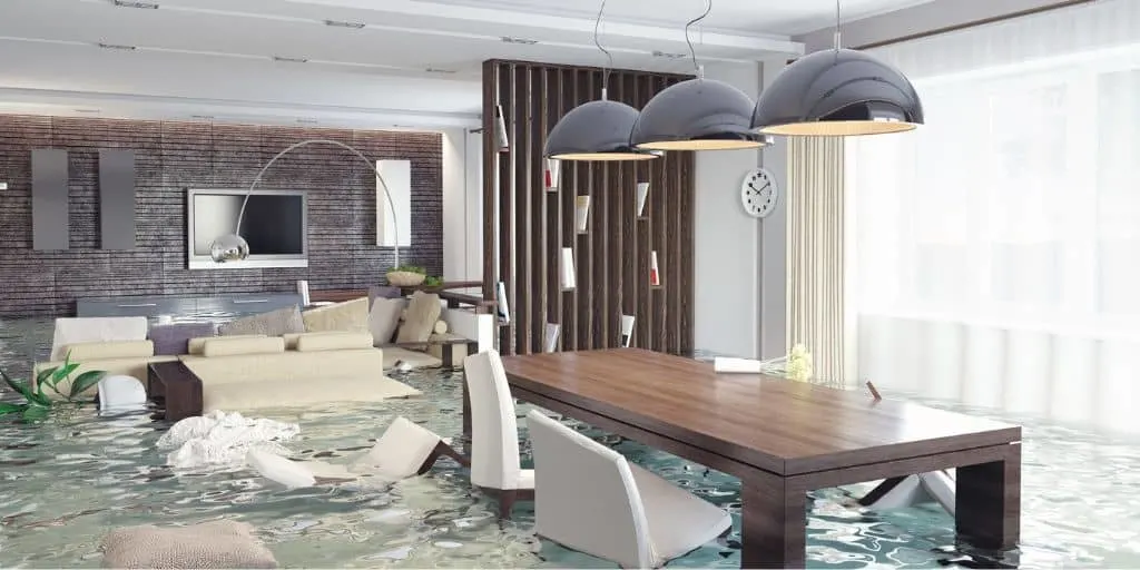 home dining room with flood damage, in flood waters