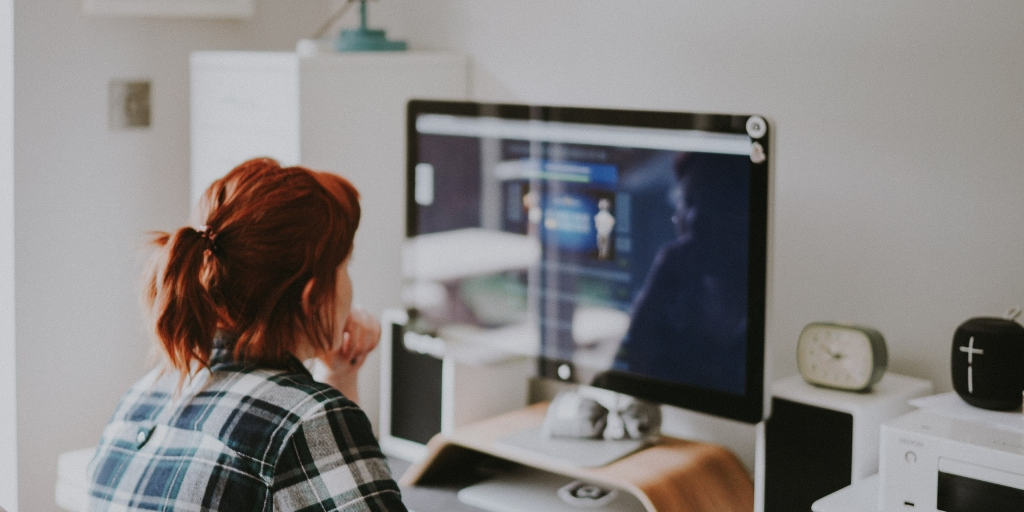 woman in front of computer, anxious, looking for employment