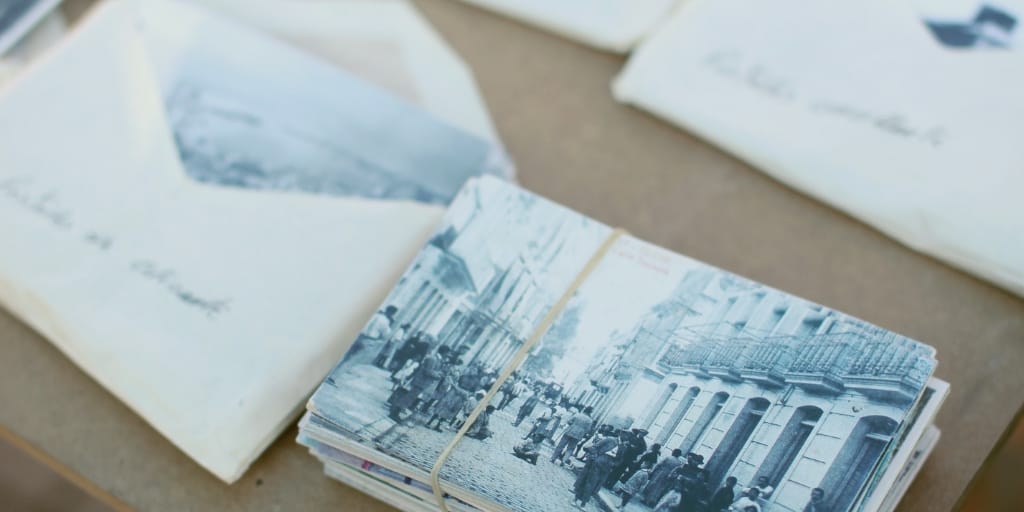 envelopes filled with old photos and genealogy research