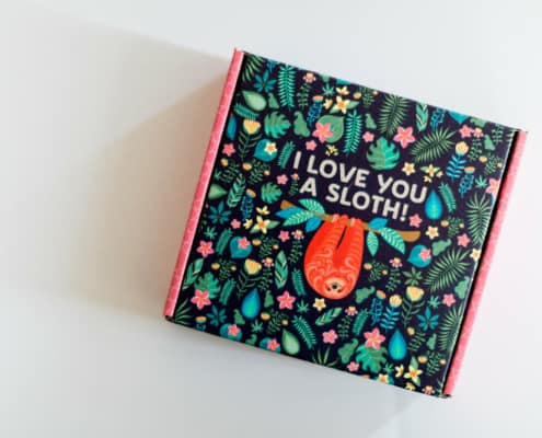 crated with love review with picture of outside of box, sloth and jungle on it