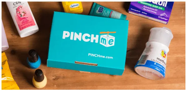 screenshot of PinchMe box with sample products on wooden desk