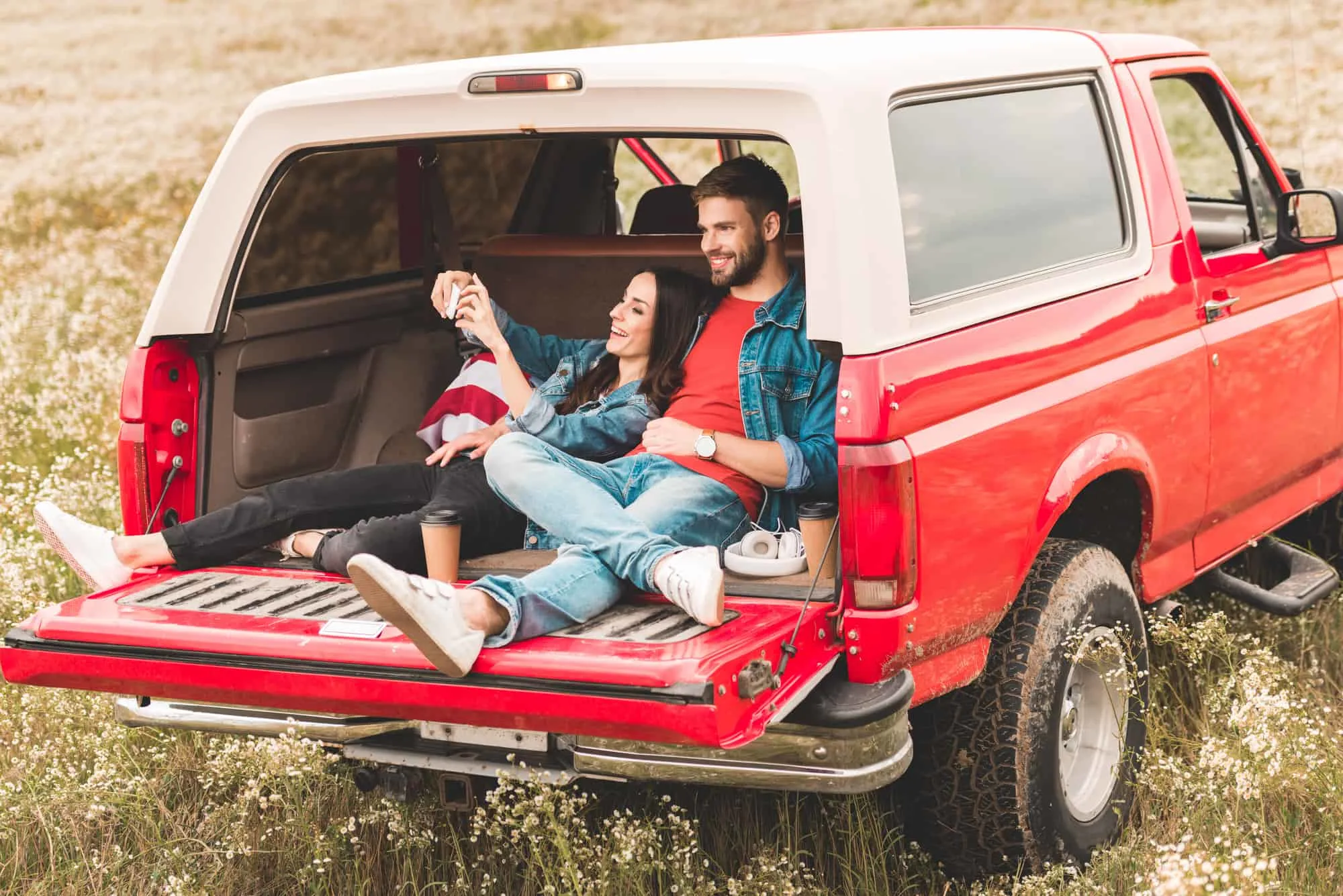 couple in back of truck for, using an outdoor date idea