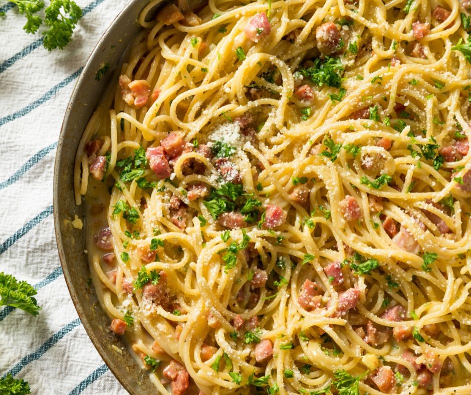 pan of hot carbonara, one of the great inexpensive meals for large groups