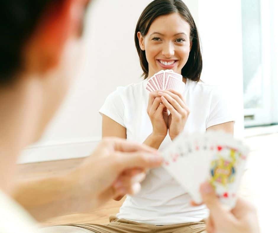 couple playing printable card games for adults PDFs - smiling at each other