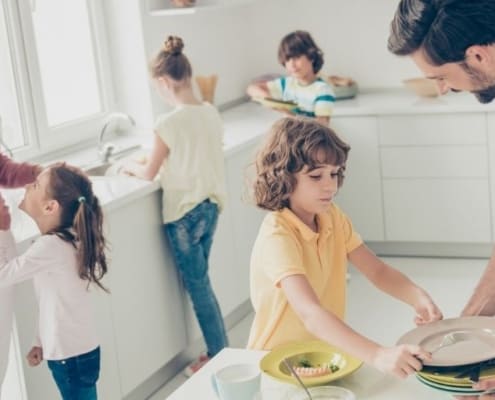 large family in kitchen, kids helping parents cook - large family saving money