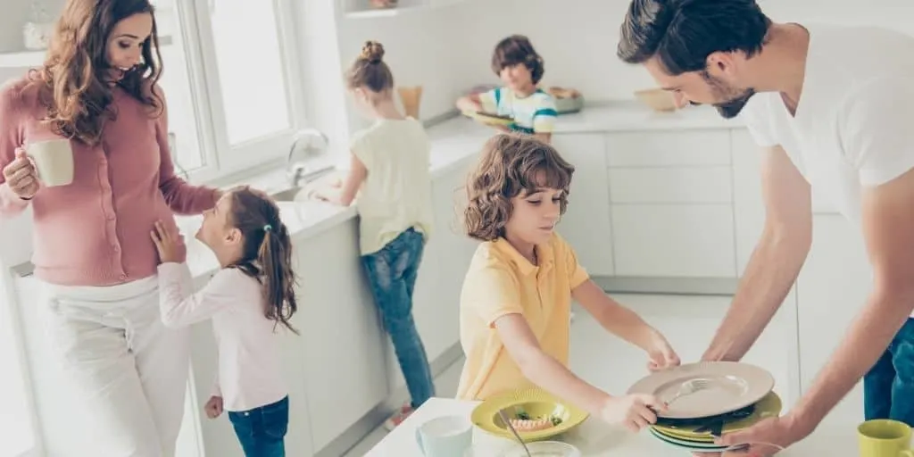 large family in kitchen, kids helping parents cook - large family saving money