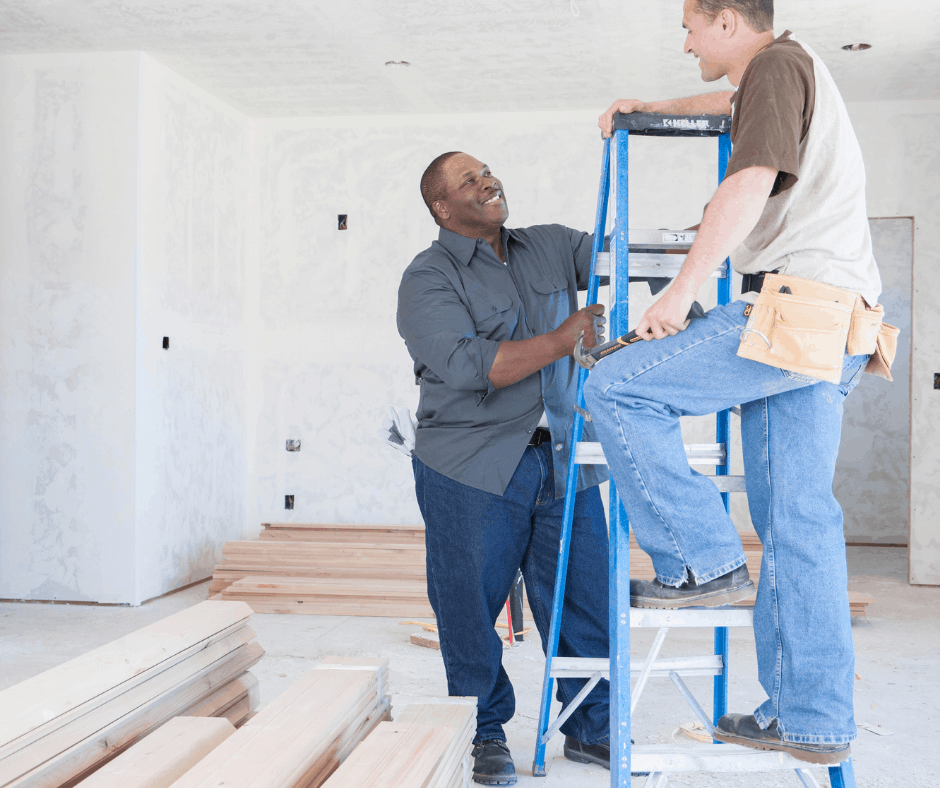 two contractors on a ladder, smiling and talking, how to negotiate a lower price contractor