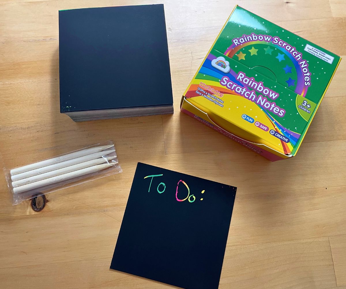 black Scrach Notes stack with wooden stylus pens and "To Do" in rainbow on one