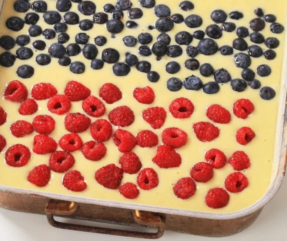 sheet pan of pancakes with berries on top
