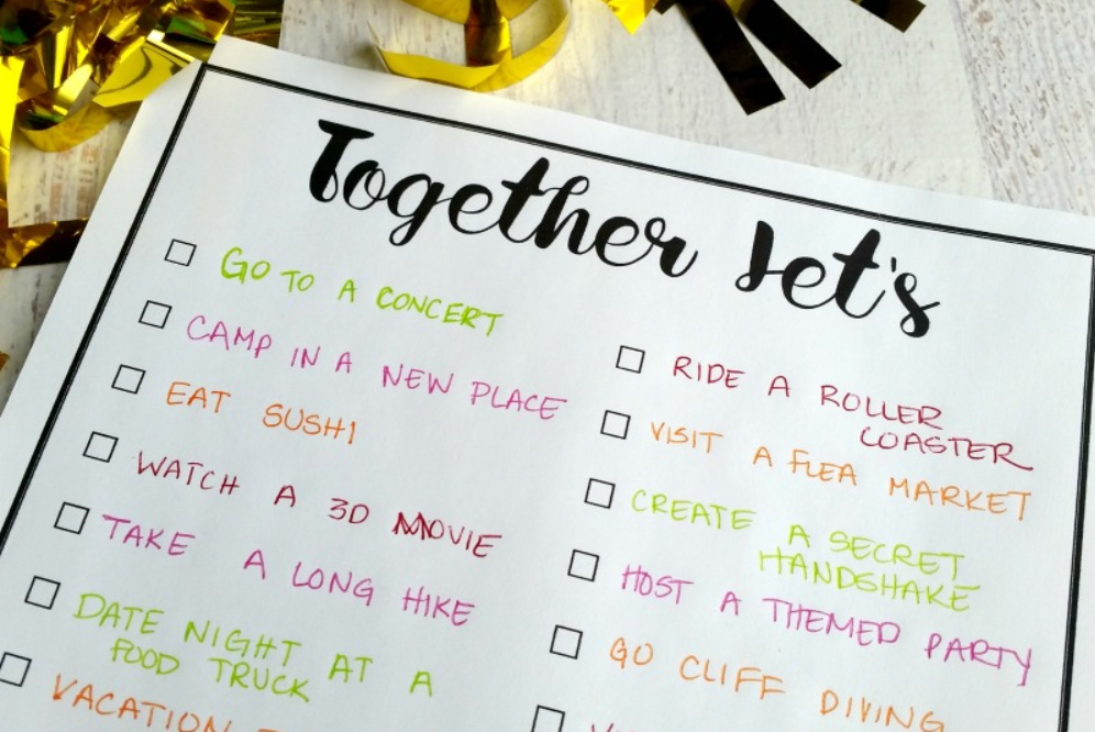 black and white couple's bucket list printable "Together Let's" at top, and written in with ideas 