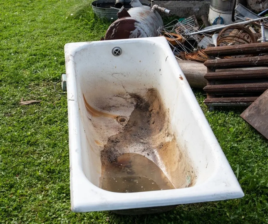 cast iron tub in pile of best scrap metal items