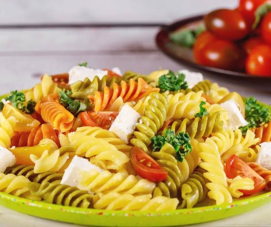 large platter of Italian pasta on green plate