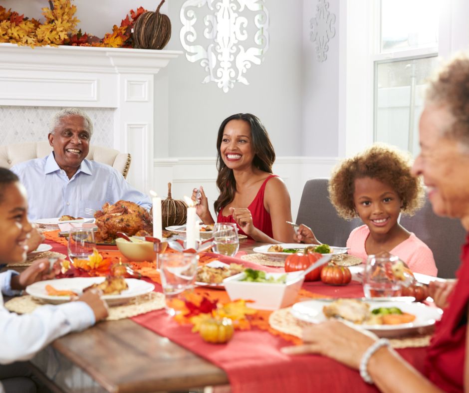 multi-generational family at Thanksgiving dinner, listening to grandmother talk