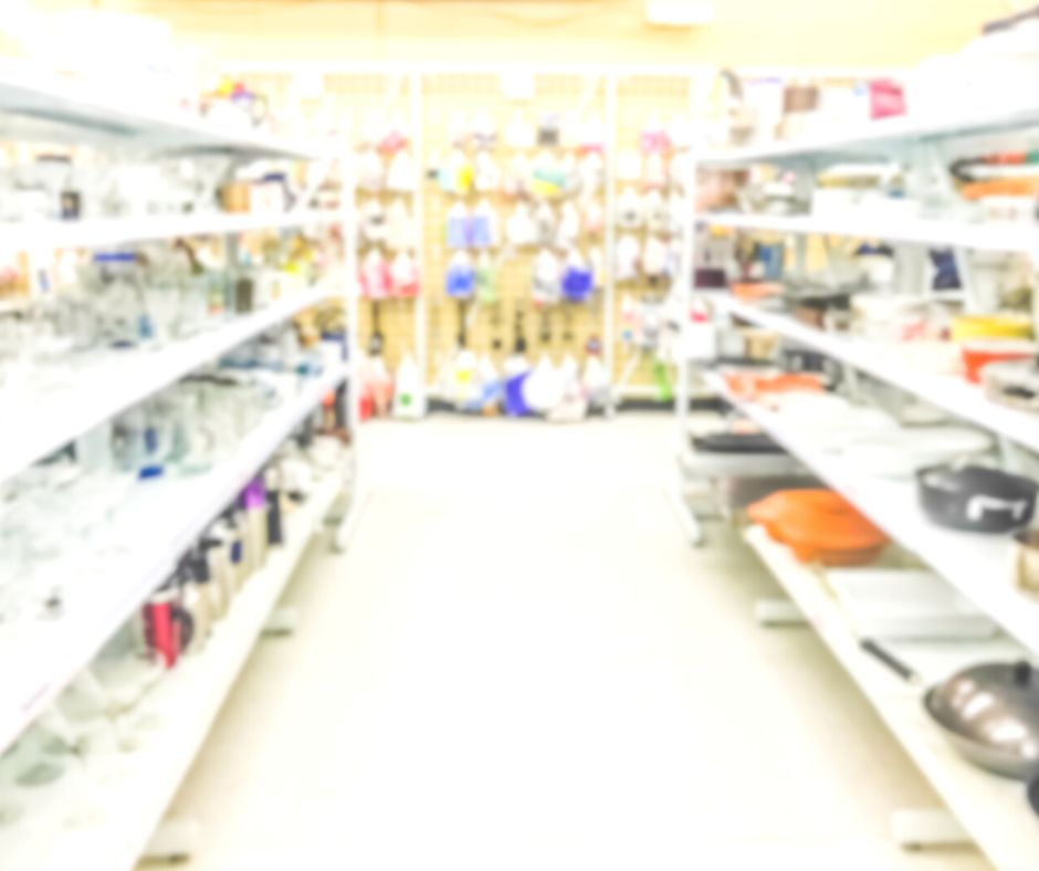 blurred image of inside of Thrift store, kitchen and decorations section