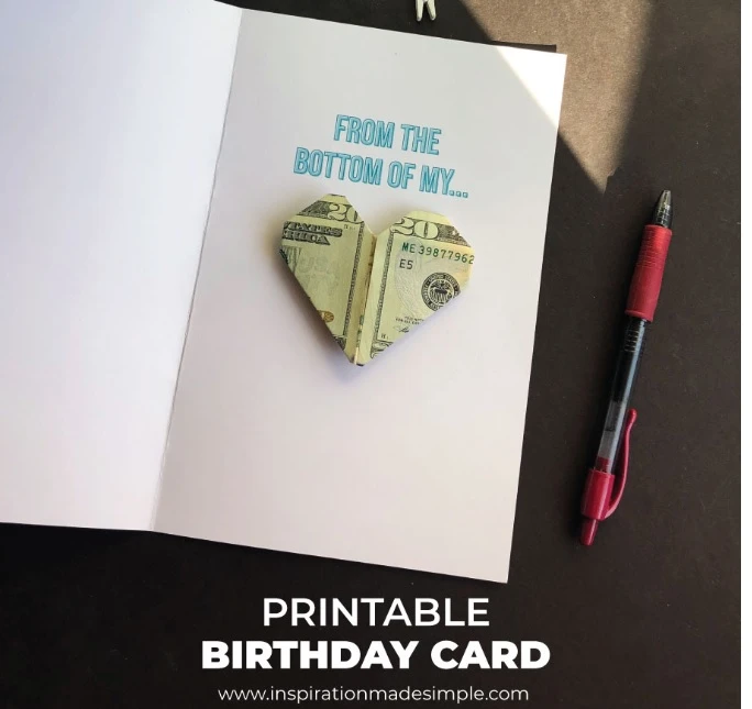 inside of card with heart-shaped origami from $20 bill, saying "from the bottom of my..."