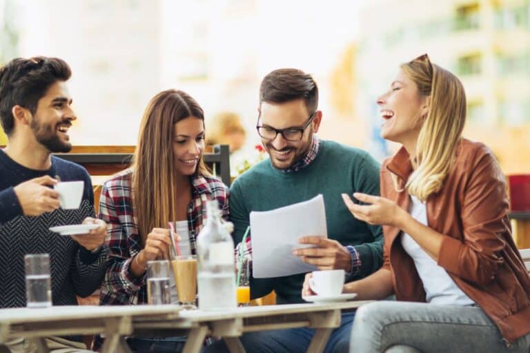 group of adults having fun playing free printable fall game at table