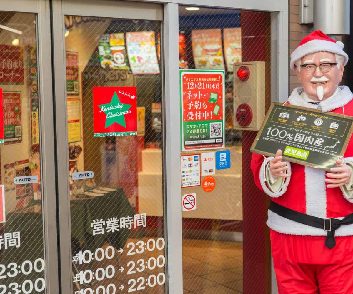 Colonel Sanders statue outside KFC wearing Santa costume in Japan