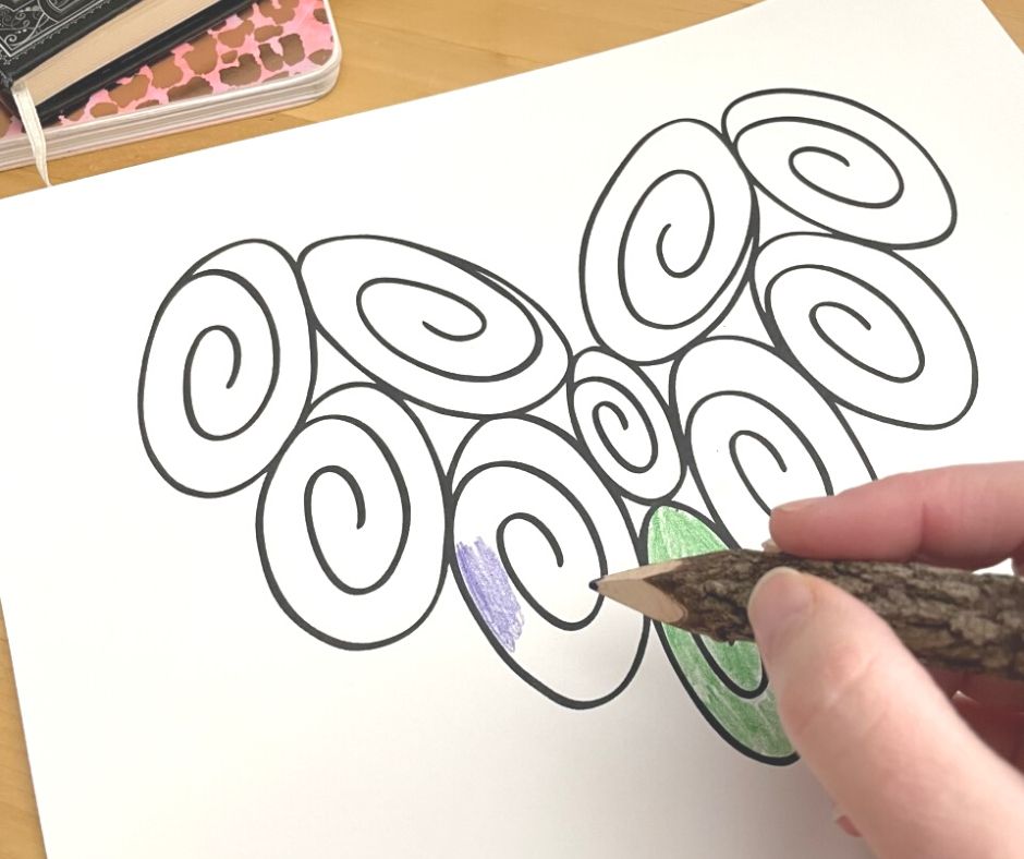ten swirls in shape of heart with person coloring in the second one