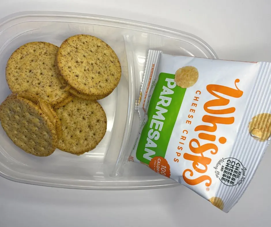 four homemade peanut butter and cracker sandwiches, and package of parmesan cheese whisps in container