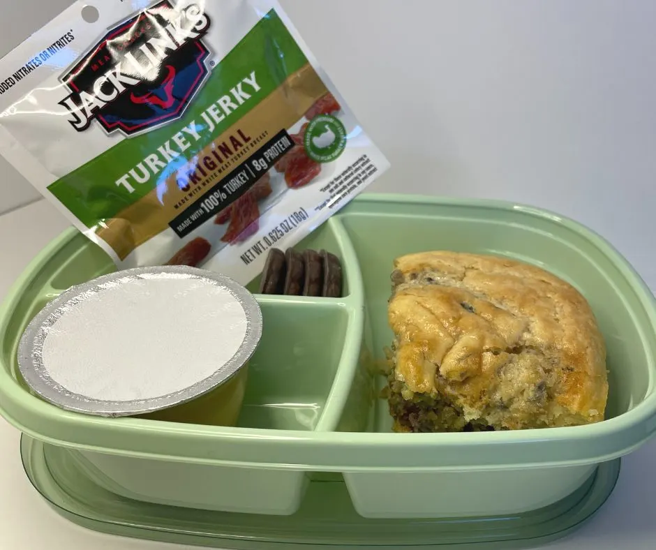 PB&J pancake tray bake serving with beef jerky package, and package of apple sauce