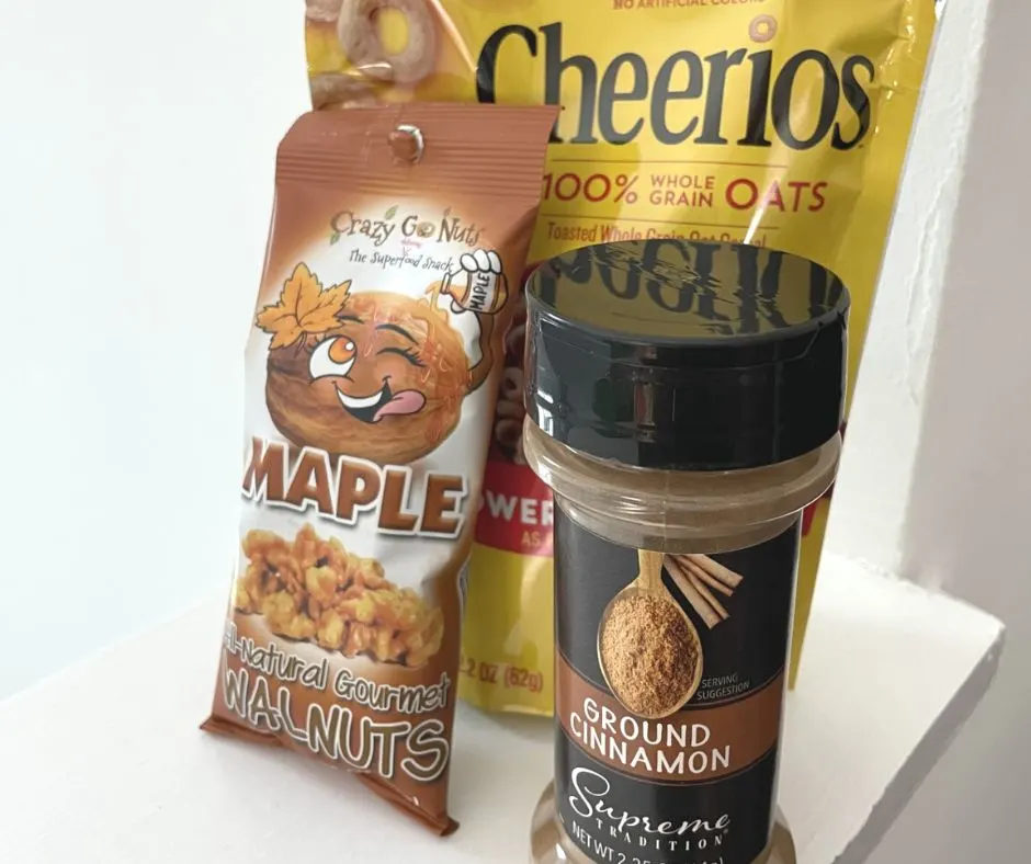 cheerios, maple walnuts, and ground cinnamon on white background