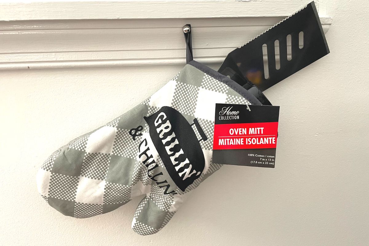 grilling oven mitt with grill tool and seasoning, hanging like stocking