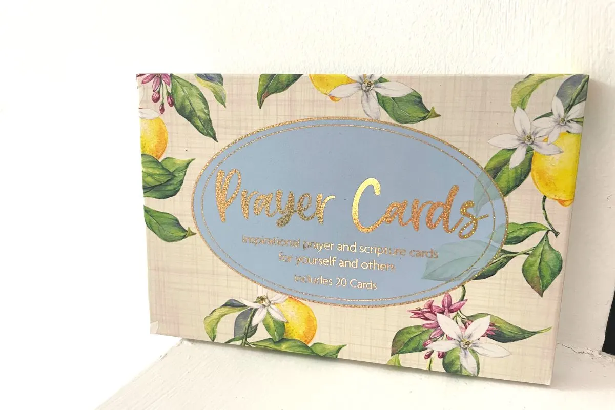 gorgeous floral designed box with gold wording "prayer cards"