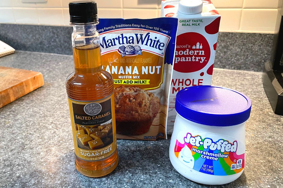 banana nut muffin mix, milk, caramel syrup, and marshmallow fluff on kitchen counter