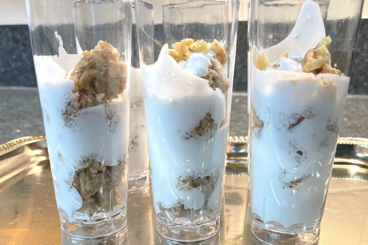 six dessert shooters on silver tray, with marshmallow fluff and banana nut muffins