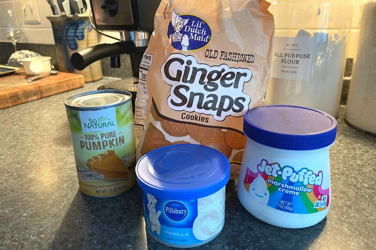 ginger snaps, can of pumpkin, marshmallow fluff, and vanilla icing on kitchen counter