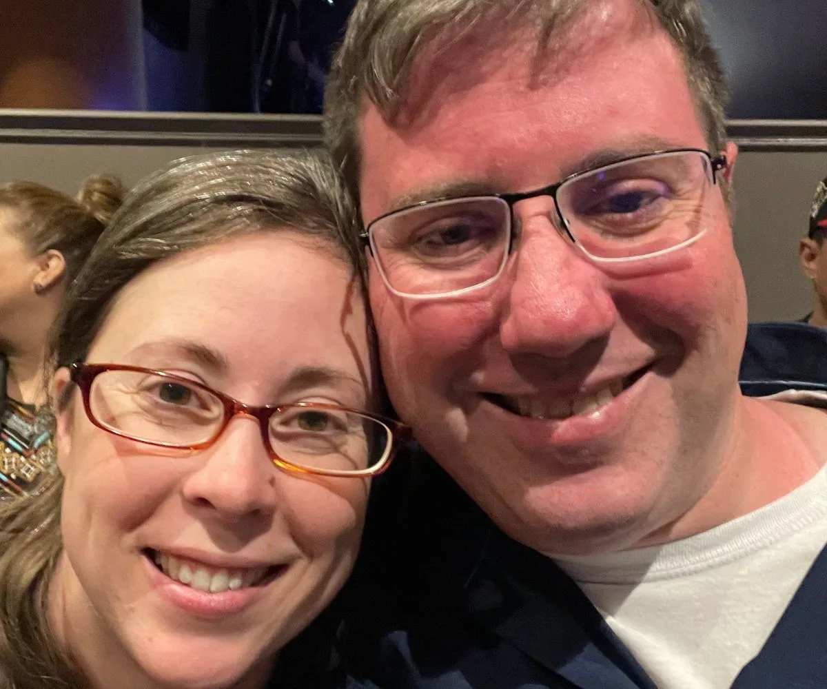 couple smiling enjoying a Married comedy night