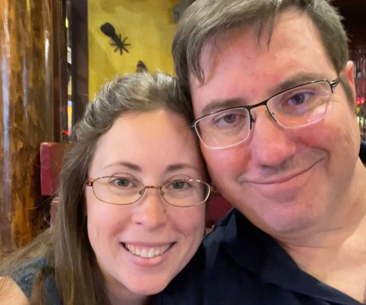 couple smiling together in a restaurant