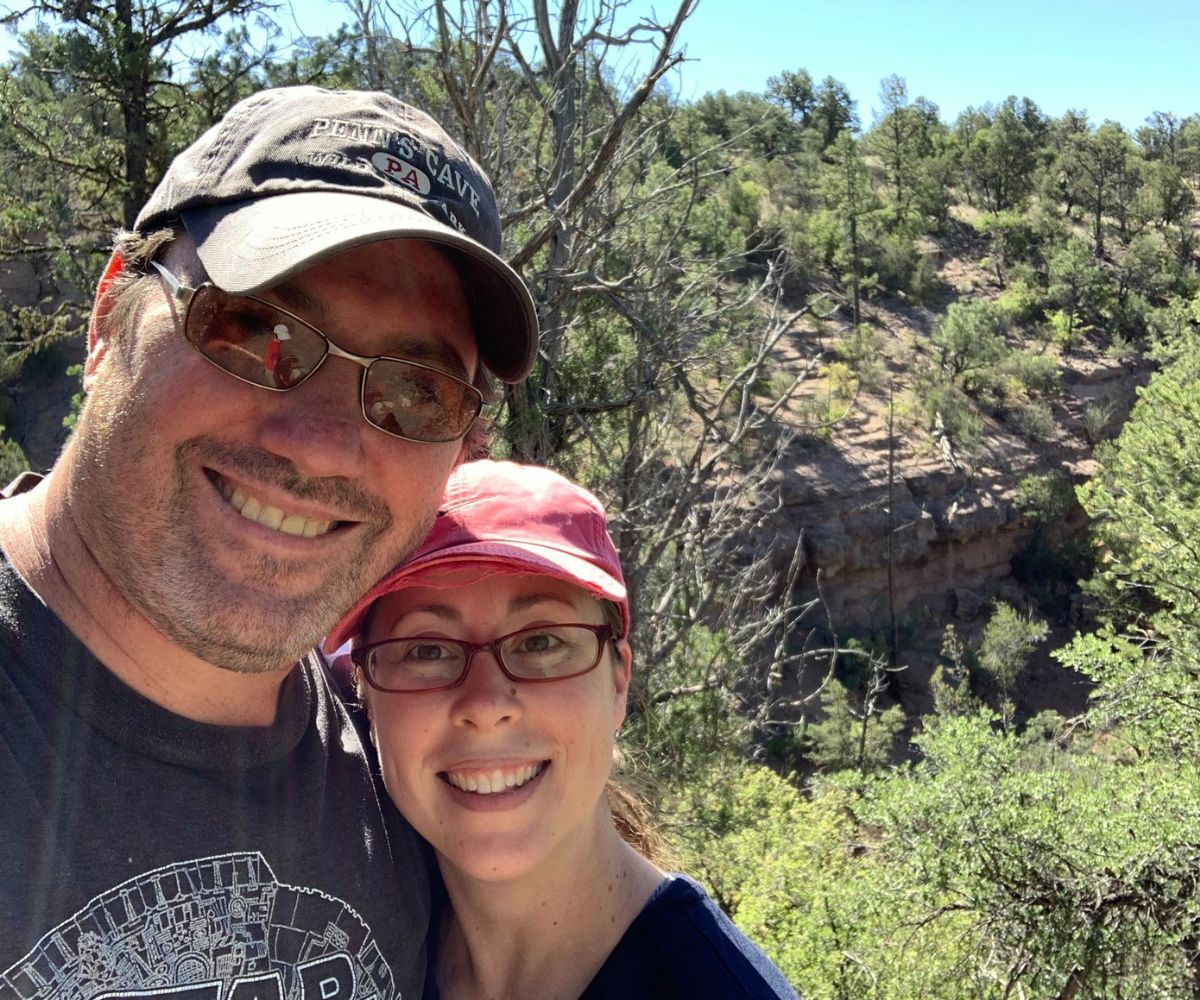 couple smiling into camera in New Mexico wilderness