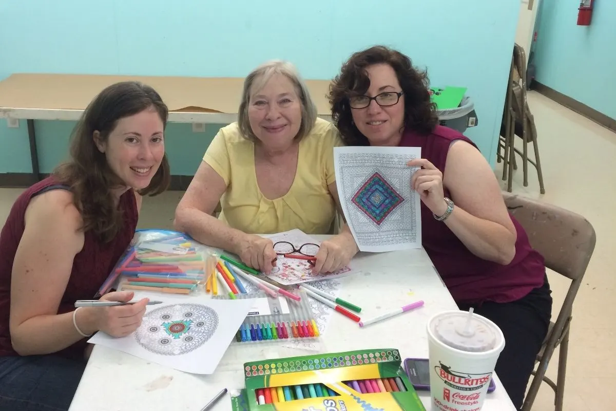 author with mother-in-law and sister-in-law showing off mandala colorings