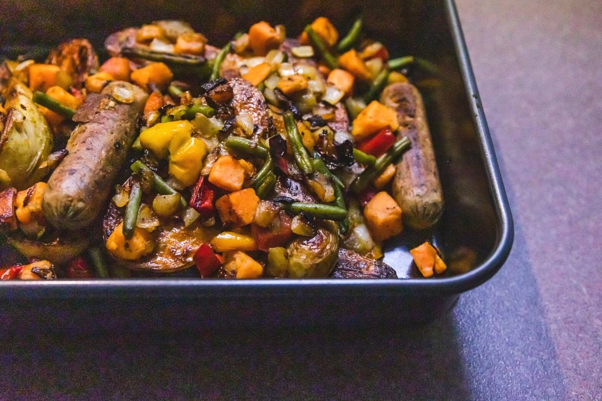 big black pan of roasted sausage and vegetables