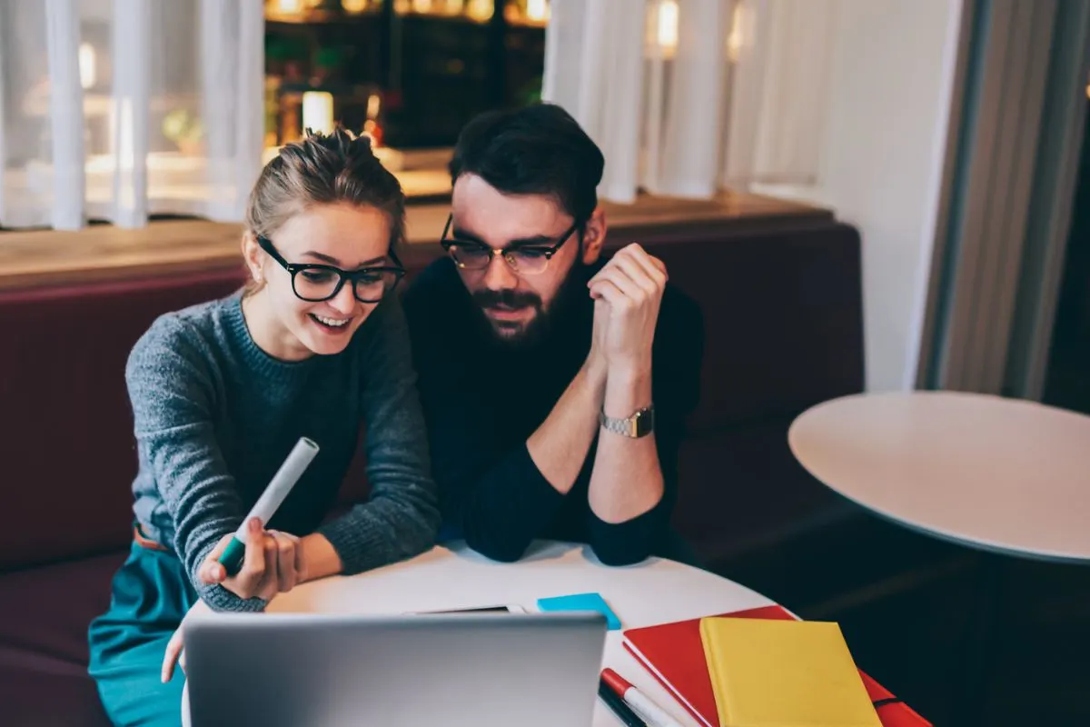 couple at coffee shop working on fun escape room together