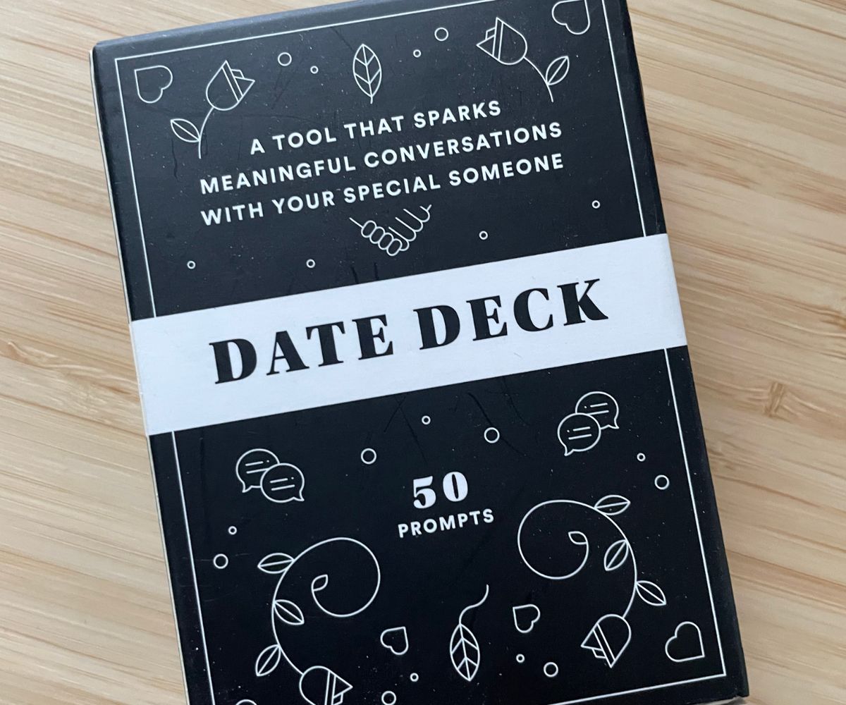 black and white deck of date question on bamboo desk