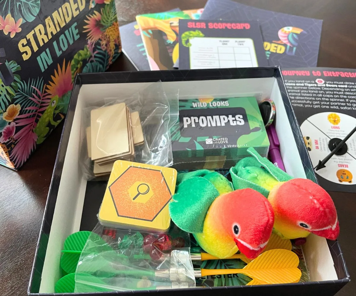 colorful date night subscription box opened on table with jungle theme