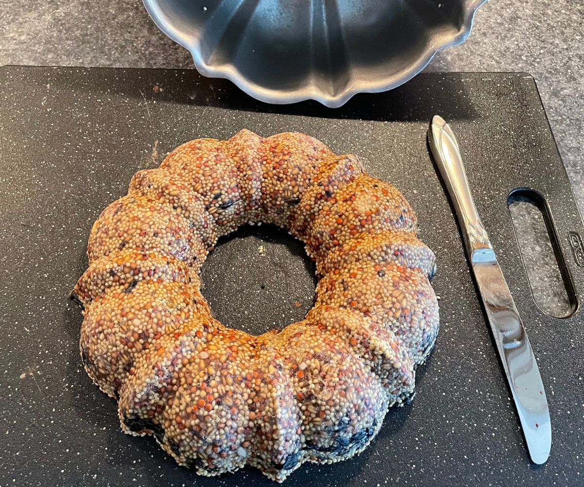 bundt pan emptied of the wreath, with butter knife next to it