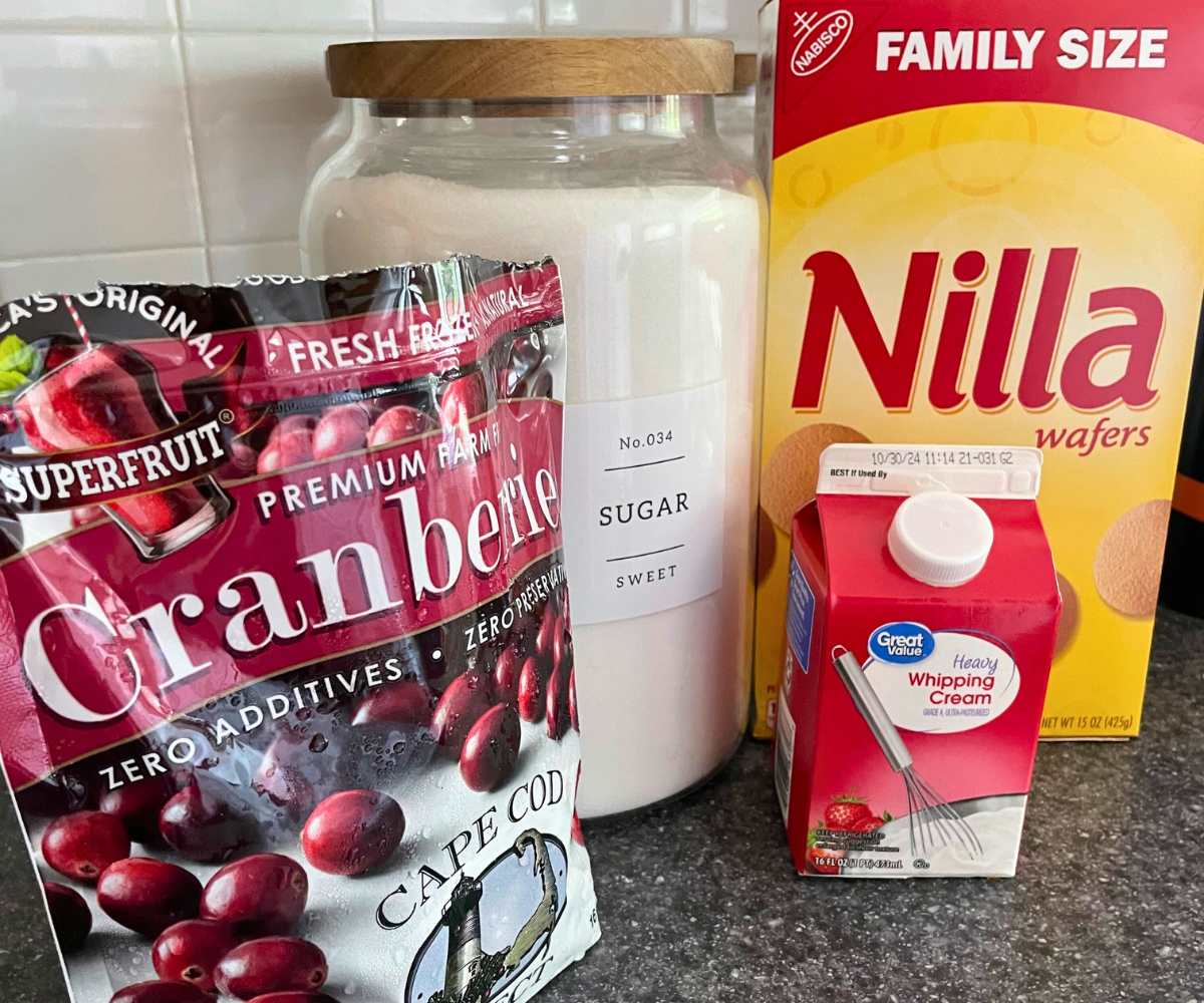 cranberries, heavy whipping cream, Nilla Wafers, and sugar container on counter